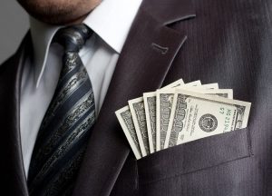 Businessman with one hundred dollars in pocket