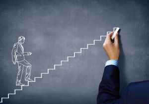 Chalk drawing of man walking up stairs