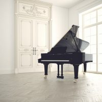 Grand piano in an empty room
