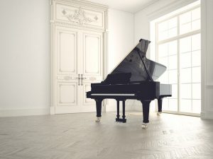 Grand piano in an empty room